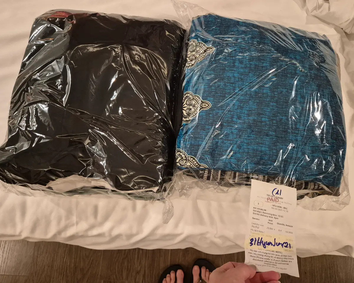 Folded clothes sealed in plastic bags with a ticket attached