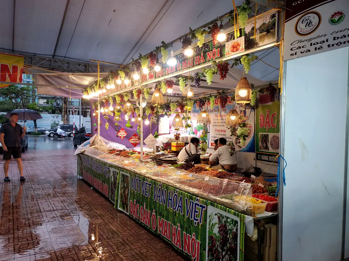 Food counter under strings of lights at night