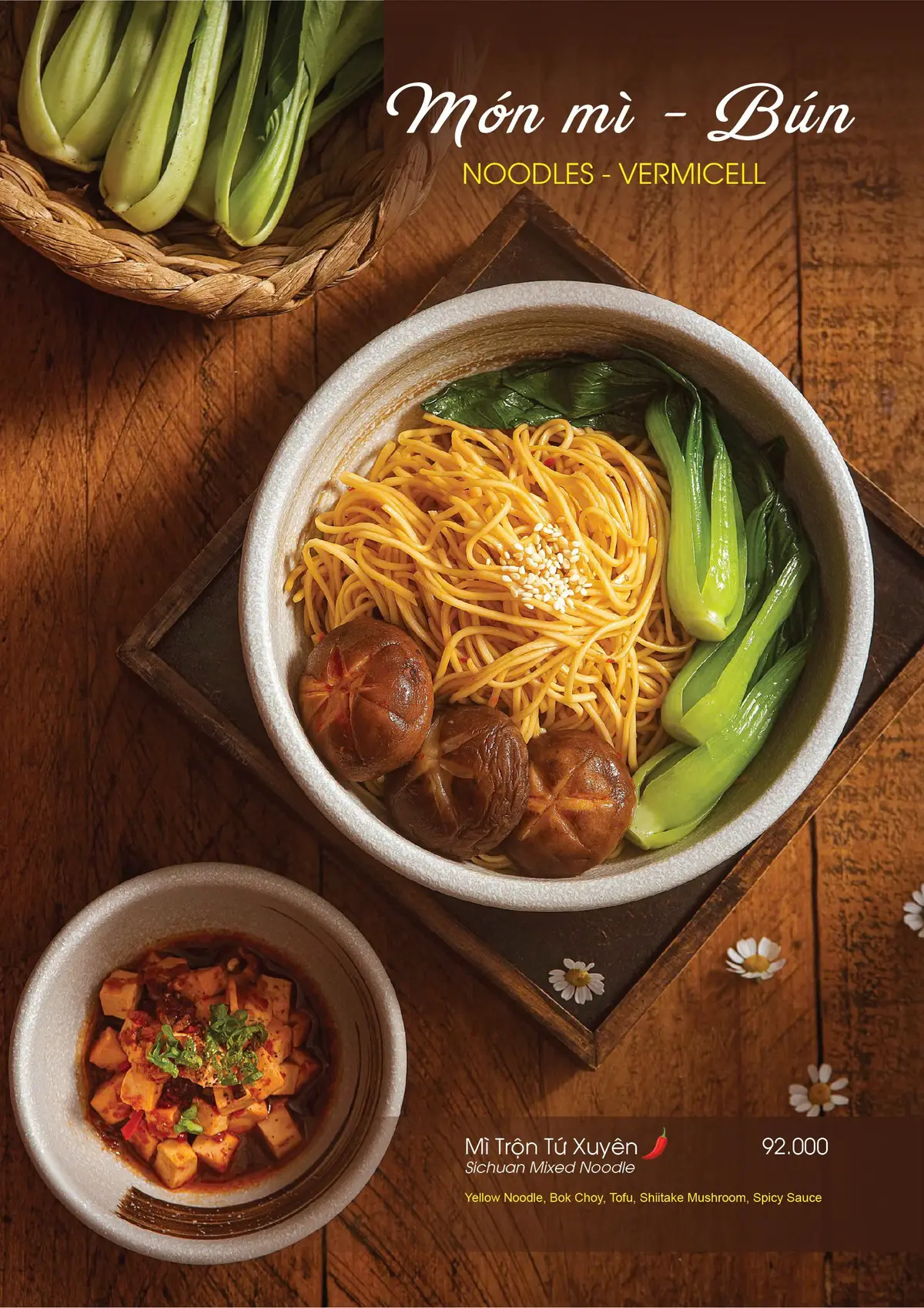 Bowl of egg noodles with shiitake mushrooms and greens on a wooden tray